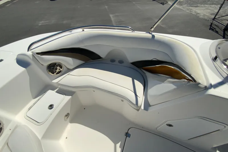 Slide: The Image of 2010 Hurricane SunDeck Sport 200 OB boat interior with damaged seating and storage compartments. - 15