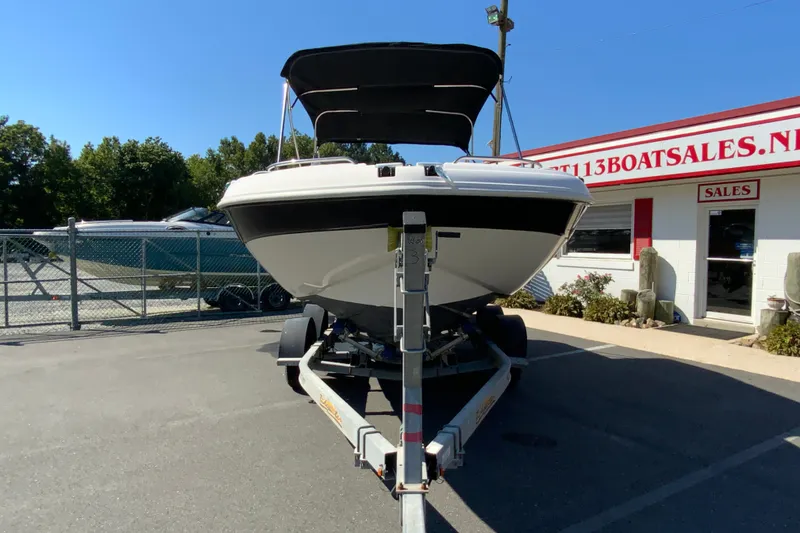 Slide: The Image of 2010 Hurricane SunDeck Sport 200 OB boat on trailer at dealership. - 4