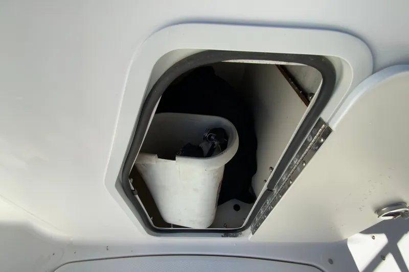 Slide: The Image of Storage compartment on a 2010 Hurricane SunDeck Sport 200 OB boat. - 20