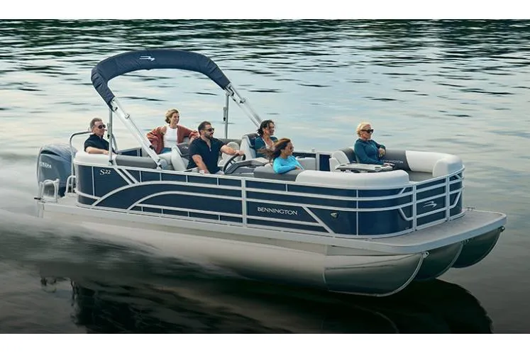 The Image of Manufacturer Provided Image: 2026 Bennington 22 S-One Quad Bench pontoon boat cruising on a calm lake. - 0
