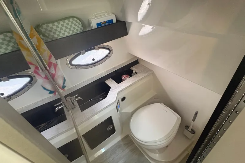 Slide: The Image of Interior of 2018 Formula 330 Crossover Bowrider I/O boat bathroom with sink and toilet. - 20