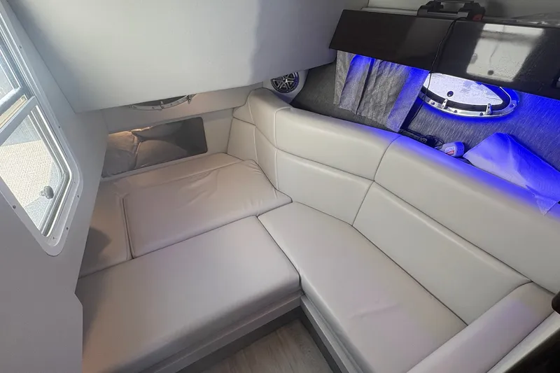 Slide: The Image of Interior of 2018 Formula 330 Crossover Bowrider I/O with plush seating and ambient lighting. - 18
