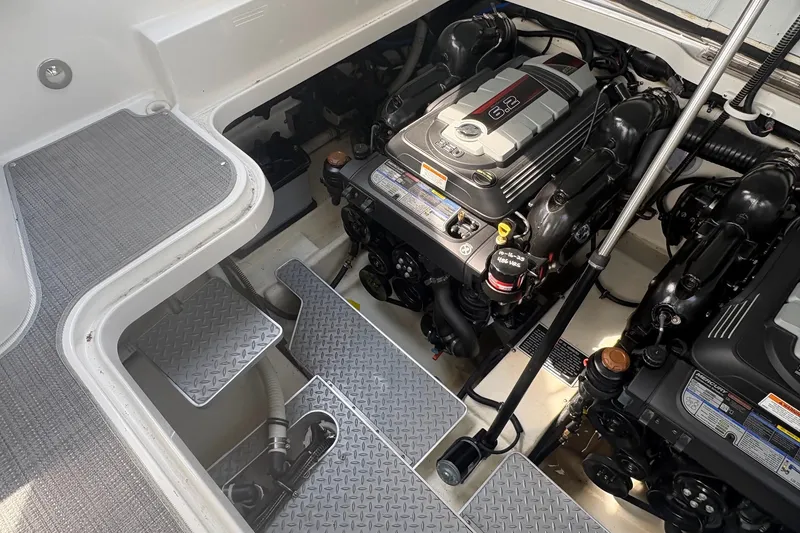 Slide: The Image of Engine compartment of a 2018 Formula 330 Crossover Bowrider I/O with visible components. - 23