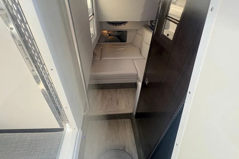 Slide: The Image of Interior cabin of 2018 Formula 330 Crossover Bowrider I/O with seating and wood accents. - 21