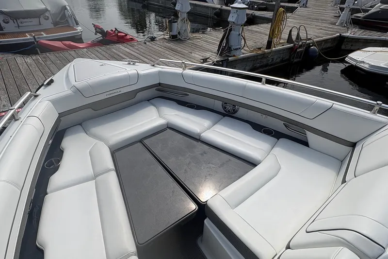 Slide: The Image of Luxurious 2018 Formula 330 Crossover Bowrider I/O with spacious seating at marina dock. - 17