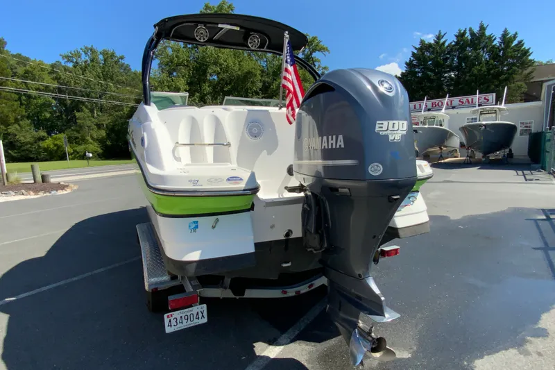 Slide: The Image of 2013 Hurricane SunDeck 2400 OB boat with Yamaha 300 V6 engine, parked on trailer. - 9
