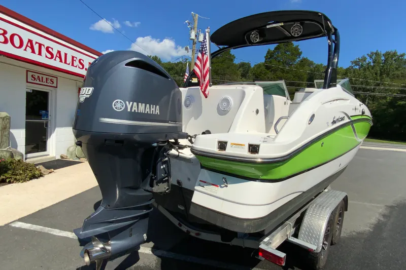 Slide: The Image of 2013 Hurricane SunDeck 2400 OB boat with Yamaha engine at dealership. - 10