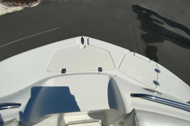 Slide: The Image of 2013 Hurricane SunDeck 2400 OB boat deck with storage compartments. - 23