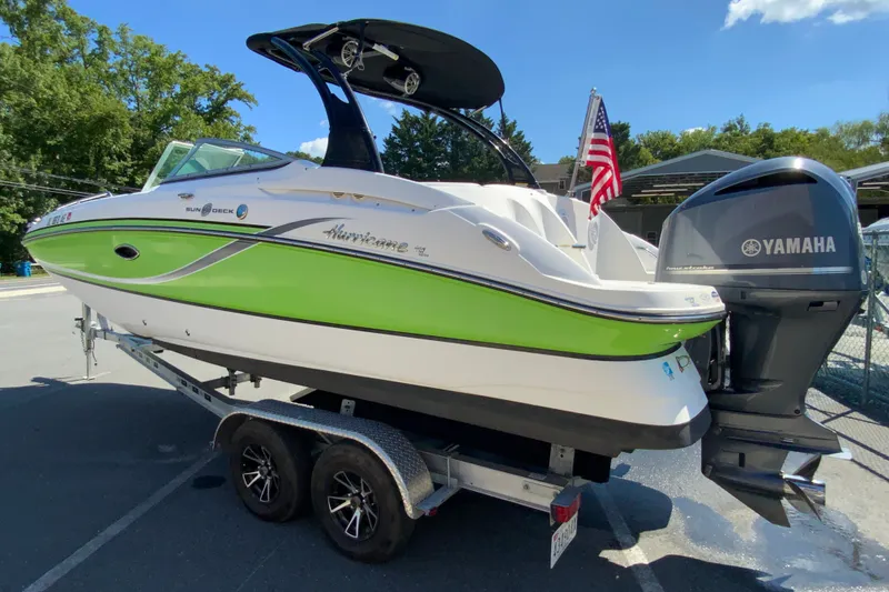 Slide: The Image of 2013 Hurricane SunDeck 2400 OB boat on trailer with Yamaha outboard motor. - 8