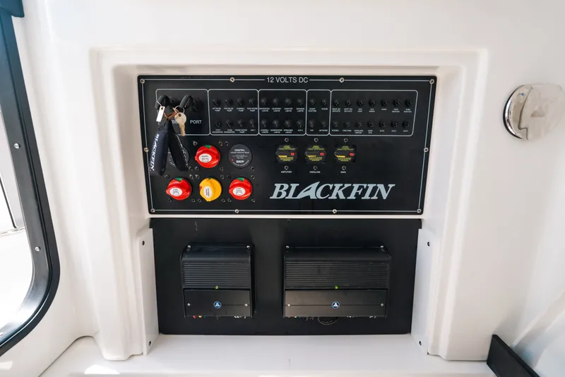 Slide: The Image of Control panel of 2023 Blackfin 272 CC boat with switches and keys. - 94