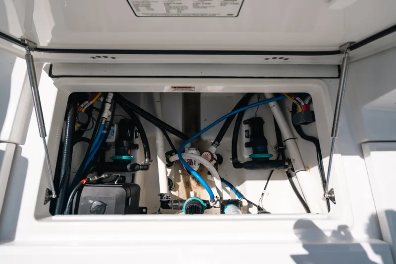Slide: The Image of 2023 Blackfin 272 CC boat compartment showcasing internal wiring and components. - 102