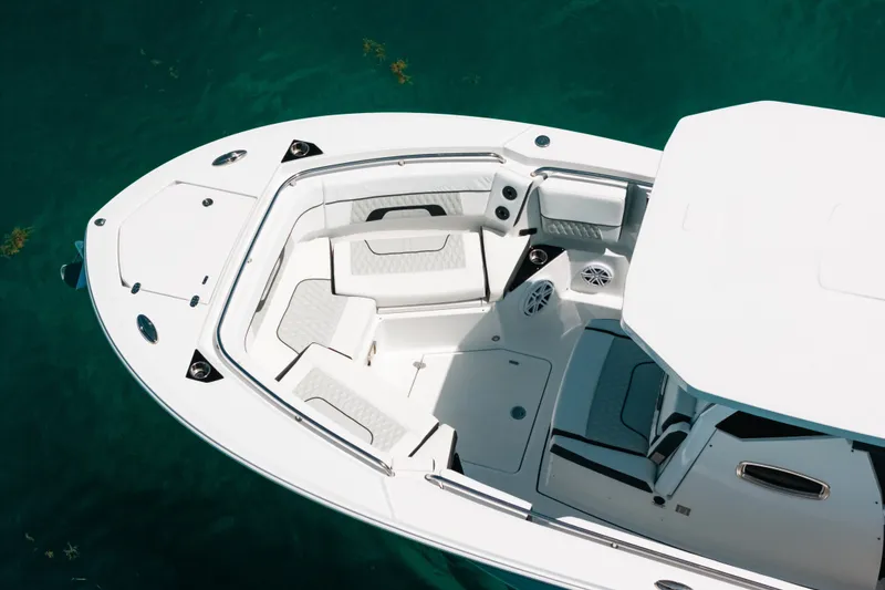 Slide: The Image of 2023 Blackfin 272 CC boat with spacious seating on clear water. - 41