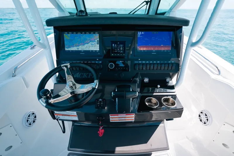 Slide: The Image of 2023 Blackfin 272 CC boat dashboard with advanced navigation and control systems. - 22