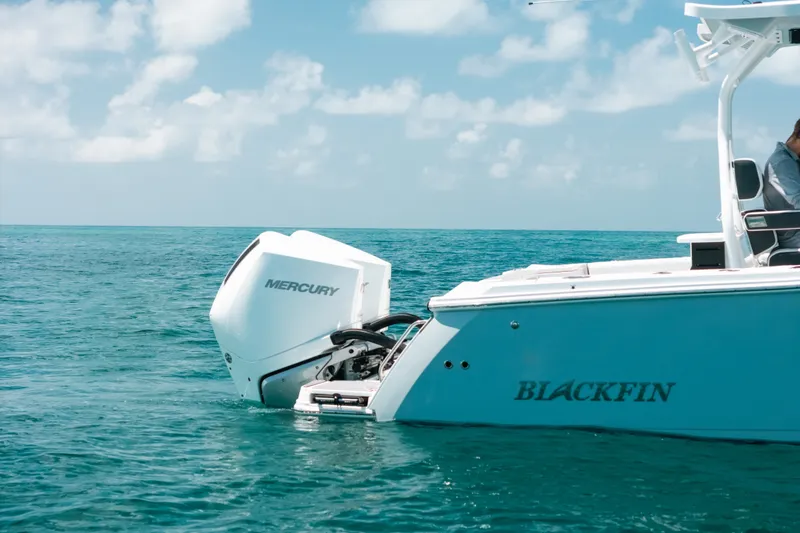 Slide: The Image of 2023 Blackfin 272 CC boat with Mercury engine on open sea. - 38