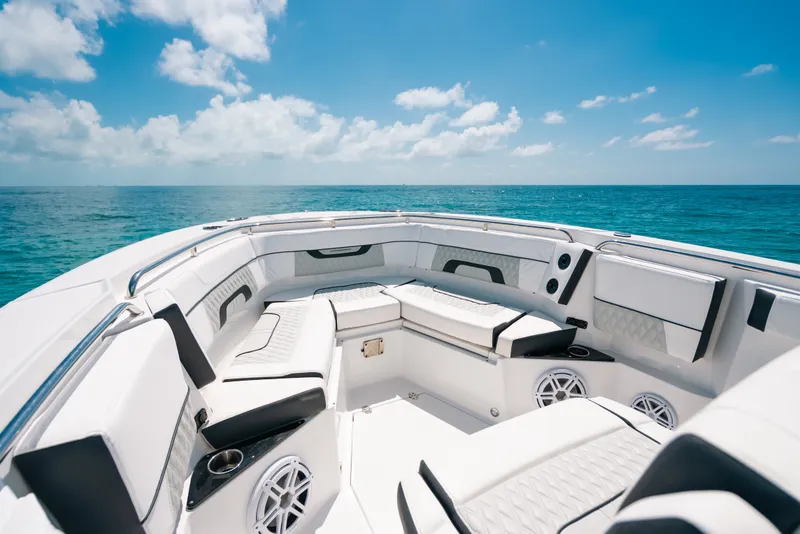 Slide: The Image of 2023 Blackfin 272 CC boat interior with luxurious seating on open ocean. - 35