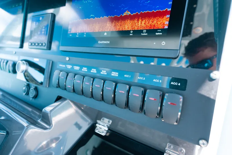 Slide: The Image of Control panel of 2023 Blackfin 272 CC boat with Garmin display and switches. - 21