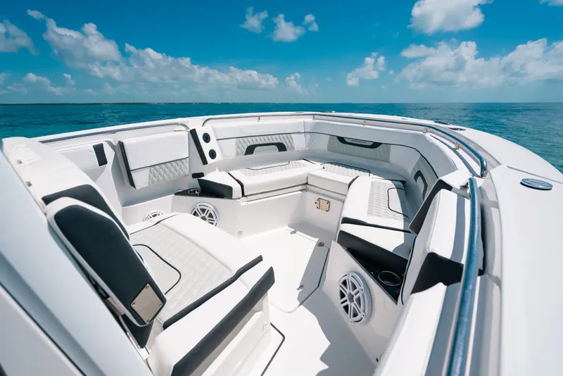 Slide: The Image of Luxurious seating area on 2023 Blackfin 272 CC boat under clear blue sky. - 34