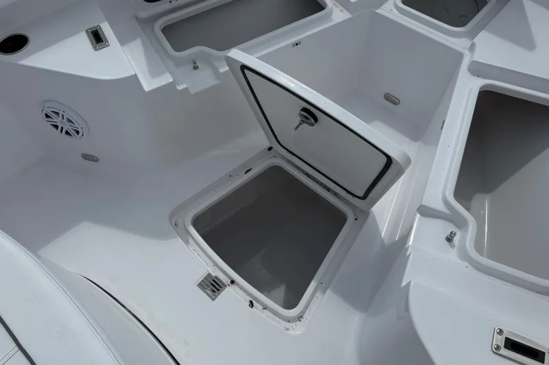 Slide: The Image of Open storage compartments on a 2027 Sportsman Heritage 231 Center Console boat. - 15