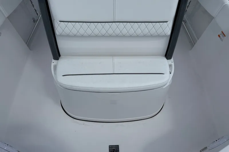 Slide: The Image of 2027 Sportsman Heritage 231 Center Console boat seat with white cushioned design. - 14