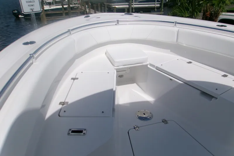 Slide: The Image of 2027 Sportsman Open 232 Center Console boat interior with seating and storage compartments. - 10