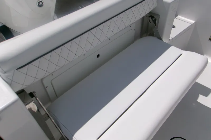 Slide: The Image of 2027 Sportsman Open 232 Center Console boat seat with diamond-patterned upholstery. - 14