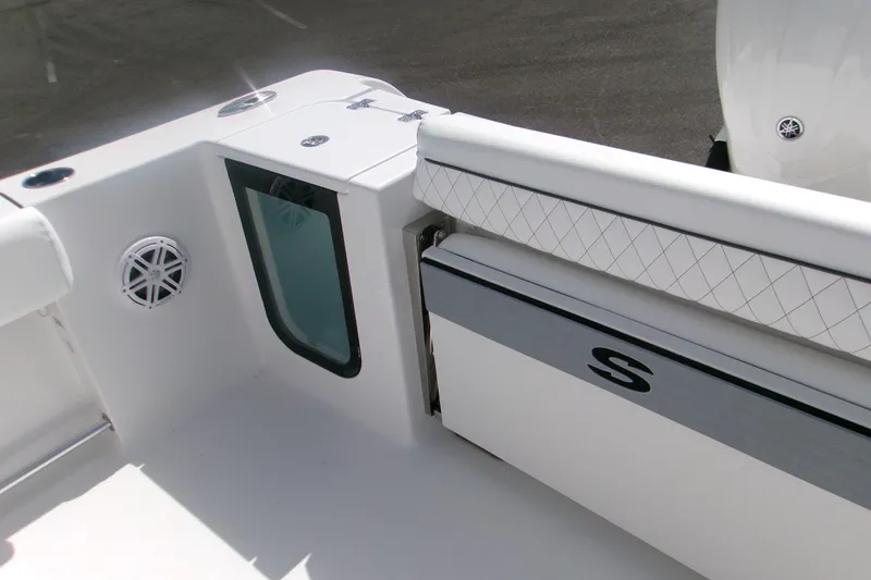 Slide: The Image of 2027 Sportsman Open 232 Center Console boat interior with seating and speaker detail. - 8