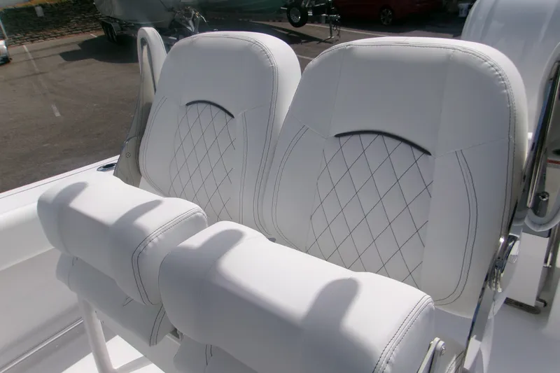 Slide: The Image of Luxurious white seating on 2027 Sportsman Open 232 Center Console boat. - 9