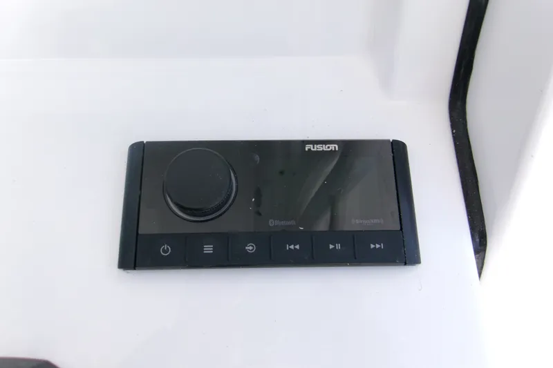 Slide: The Image of Fusion audio control panel on 2027 Sportsman Open 232 Center Console boat. - 15