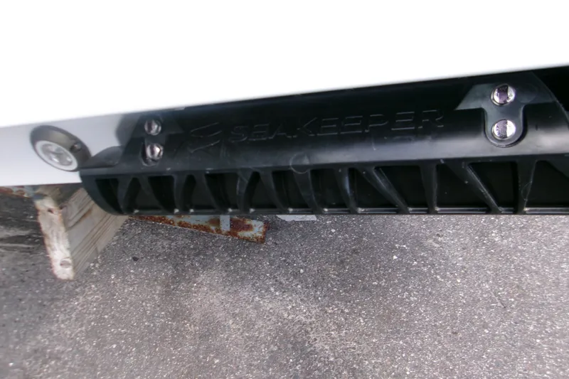 Slide: The Image of 2027 Sportsman Open 232 Center Console with Seakeeper stabilizer detail. - 6