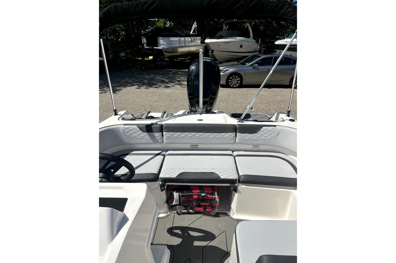 Slide: The Image of 2024 Bayliner Element M17 boat interior with seating and steering wheel. - 13
