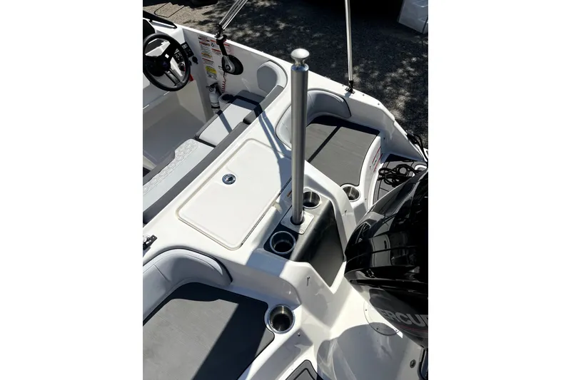 Slide: The Image of 2024 Bayliner Element M17 boat interior with seating and motor. - 12