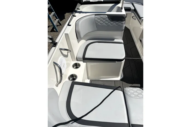 Slide: The Image of 2024 Bayliner Element M17 boat interior with cushioned seating and cup holders. - 10