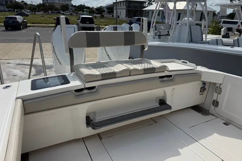 Slide: The Image of 2026 Solace 32CS boat interior with seating and storage compartments. - 7