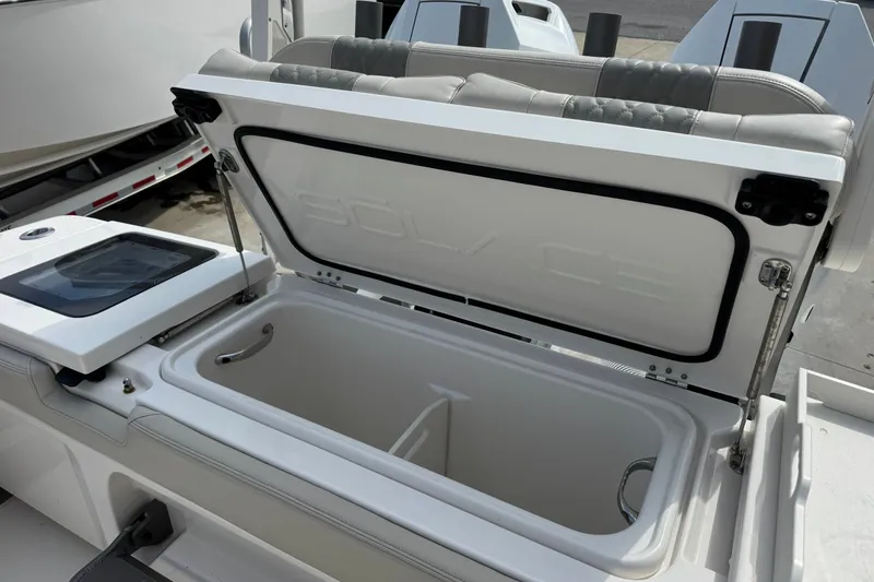 Slide: The Image of Open storage compartment on 2026 Solace 32CS boat, showcasing interior design and functionality. - 10