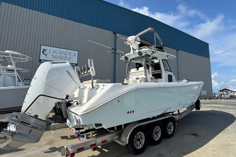 Slide: The Image of 2026 Solace 32CS boat on trailer at Grander Marine facility. - 3