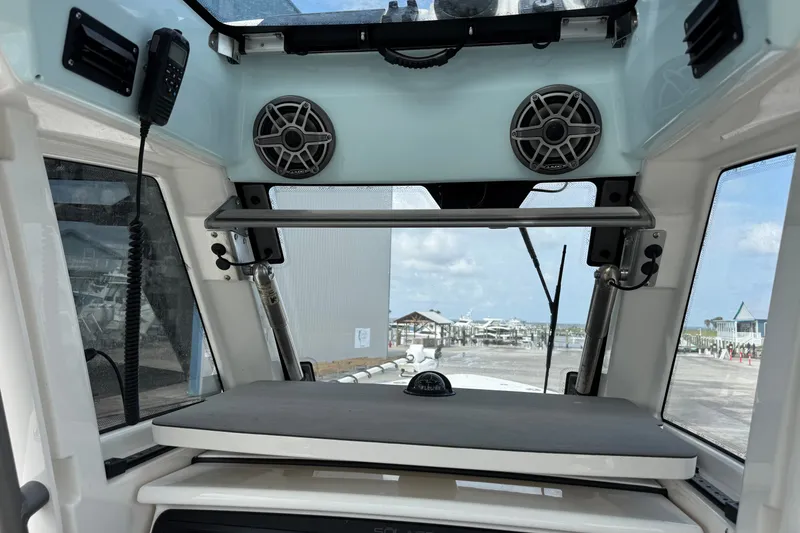 Slide: The Image of Interior view of 2026 Solace 32CS boat with speakers and control panel. - 17