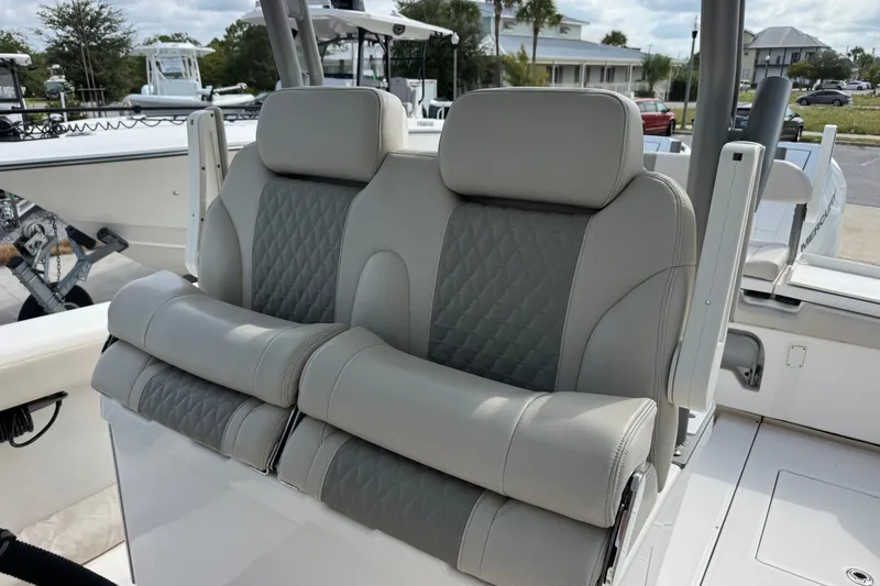 Slide: The Image of Luxury seating on 2026 Solace 32CS boat, featuring elegant gray upholstery. - 14
