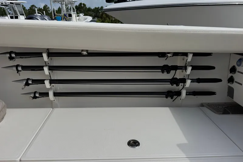 Slide: The Image of Rod holders on a 2026 Solace 32CS boat, neatly organized and secured. - 13