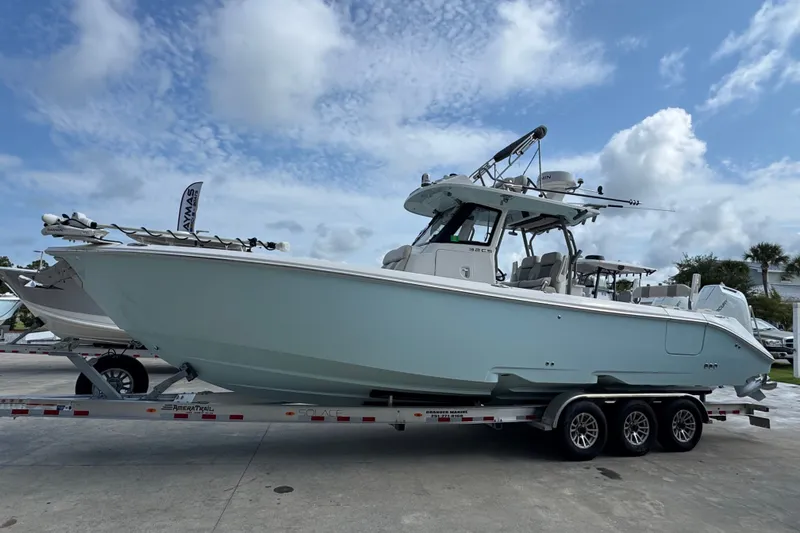 Slide: The Image of 2026 Solace 32CS boat on trailer under blue sky. - 6