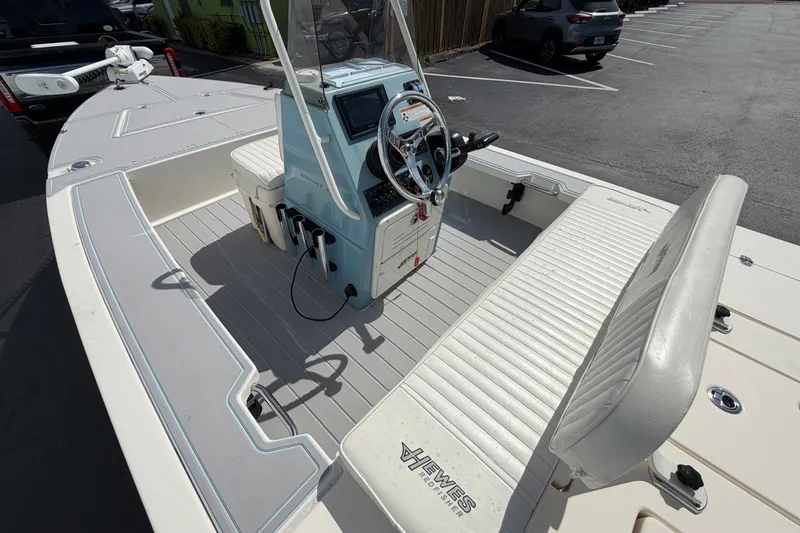 Slide: The Image of 2020 Hewes Redfisher 18 boat interior with steering console and seating. - 12
