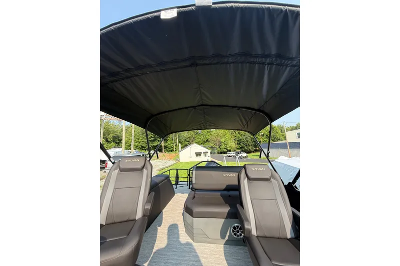 Slide: The Image of 2026 Sylvan X1 CLZ DH boat interior with canopy and comfortable seating. - 25