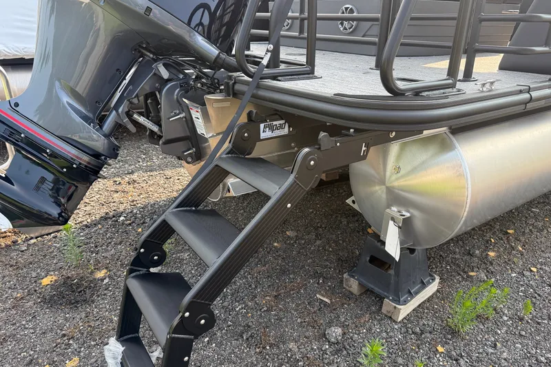 Slide: The Image of Rear view of 2026 Sylvan X1 CLZ DH boat with motor and boarding ladder. - 4
