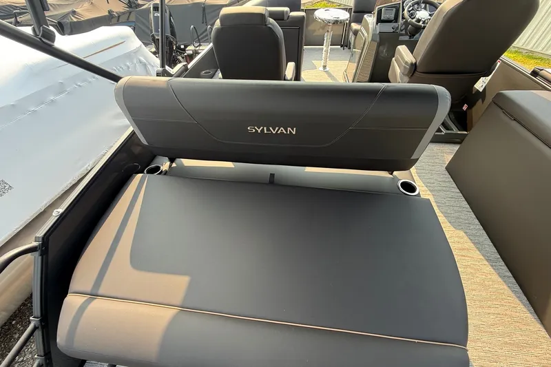 Slide: The Image of 2026 Sylvan X1 CLZ DH boat interior with comfortable seating and modern design. - 9