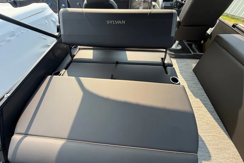 Slide: The Image of 2026 Sylvan X1 CLZ DH boat interior with convertible seating and cup holders. - 10