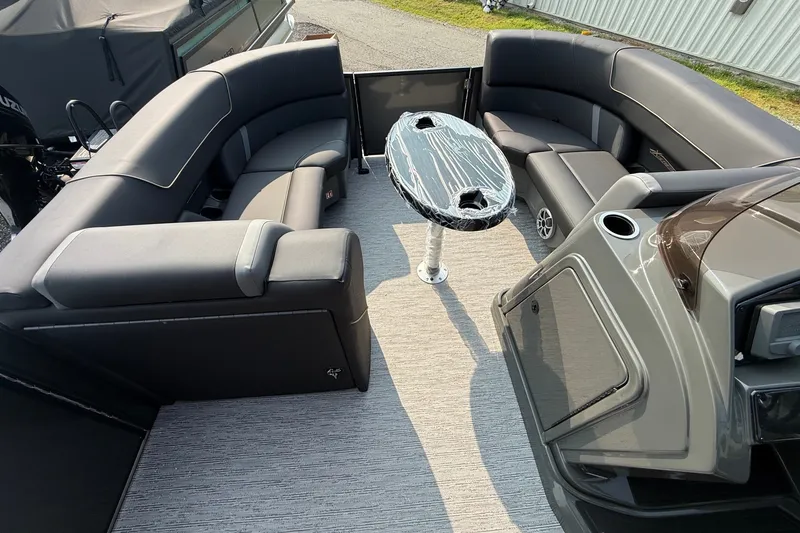 Slide: The Image of Luxurious interior of 2026 Sylvan X1 CLZ DH pontoon boat with sleek seating and table. - 13