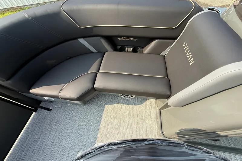 Slide: The Image of Luxurious seating in the 2026 Sylvan X1 CLZ DH boat, featuring sleek design and comfort. - 14