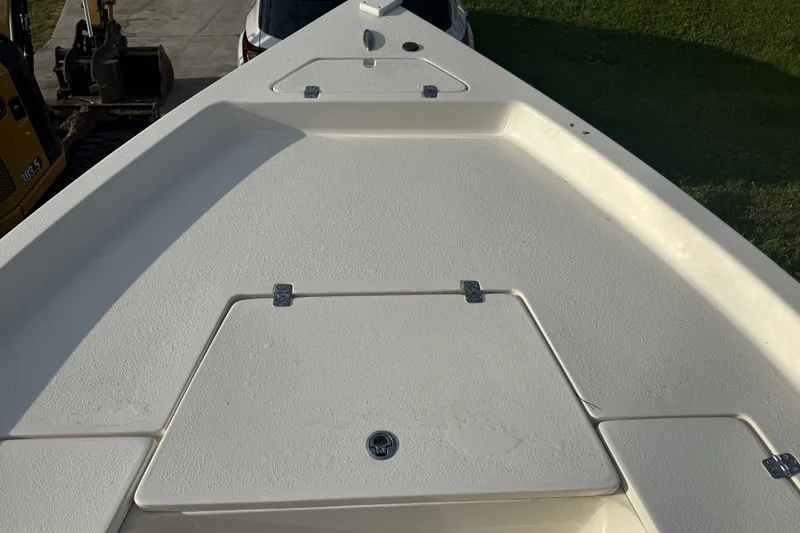 Slide: The Image of 2025 Bulls Bay 2200 XS boat deck with storage compartments. - 23