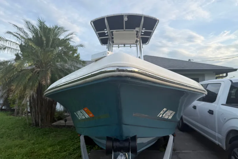 Slide: The Image of 2025 Bulls Bay 2200 XS boat on trailer, parked beside a white truck. - 5