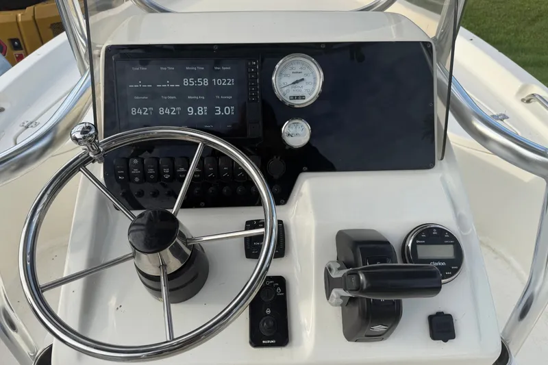 Slide: The Image of Steering console of 2025 Bulls Bay 2200 XS boat with digital display and controls. - 18