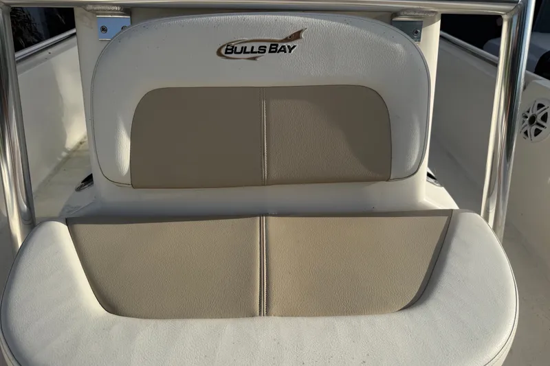 Slide: The Image of Bulls Bay 2200 XS 2025 boat seat with logo, featuring beige and white upholstery. - 25